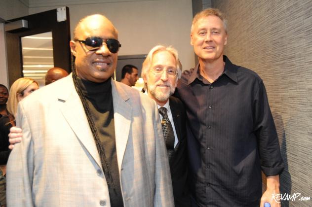 25-time GRAMMY winner Stevie Wonder, The Recording Academy President/CEO Neil Portnow, and three-time GRAMMY winner Bruce Hornsby mingling at the end of the awards ceremony.